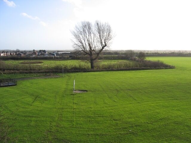 Playing Fields at Saltney Community Centre Taken from the footbridge over the A5104 Chester Road, the flatness of this former marshland can be seen clearly.