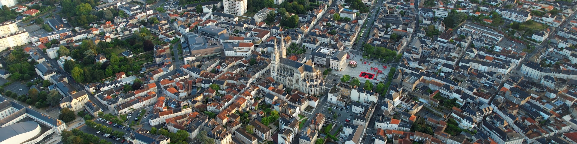 Aerial panorama view around the old town in the city Cholet in France, on a sunny summer morning