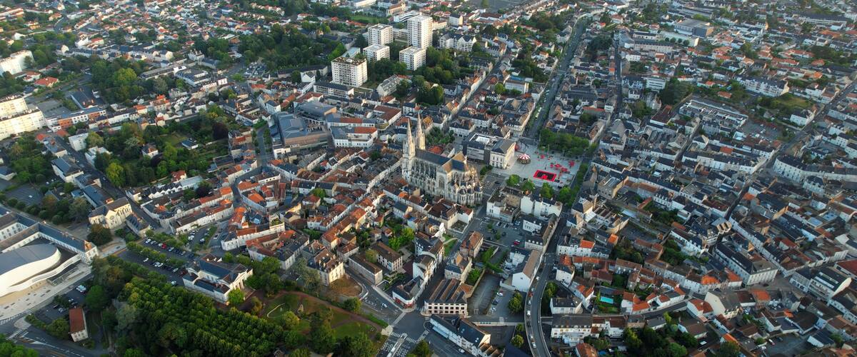 Aerial panorama view around the old town in the city Cholet in France, on a sunny summer morning