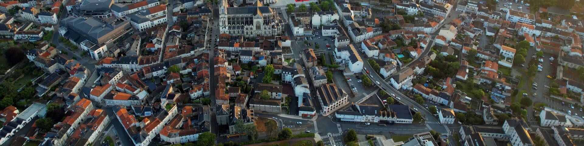 Aerial panorama view around the old town in the city Cholet in France, on a sunny summer morning