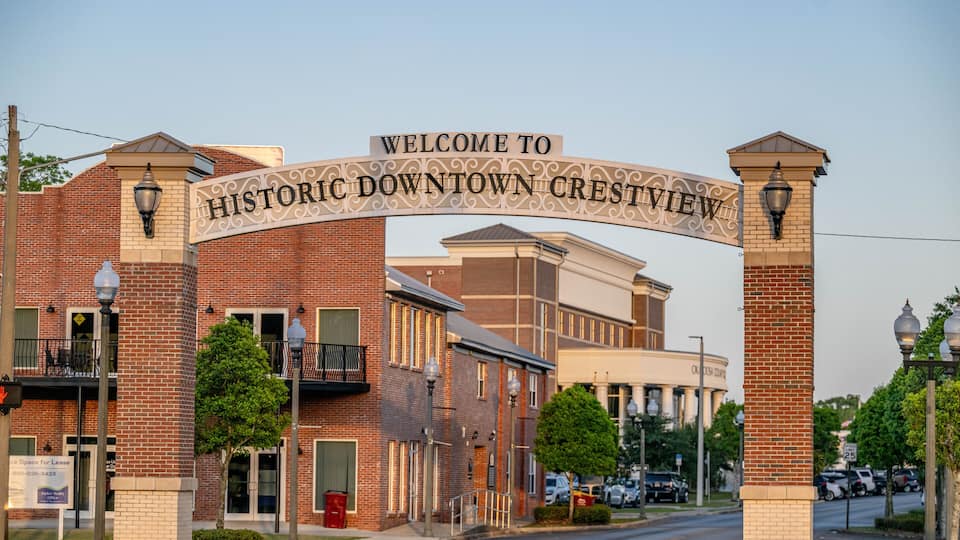 A brick building with a sign reading 'Welcome to Historic Downtown Crestview.'