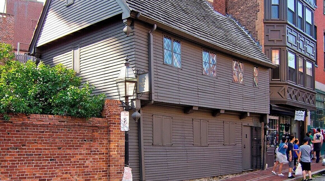 Built in 1680 after the Great Fire of 1676 destroyed a previous residence, this two-story townhouse was purchased by Paul Revere in 1770. He moved here with his wife, five children, and mother, but by the time he sold the house in 1800 he was on his second wife and had fathered a total of 16 children!
The house is typical of early Massachusetts Bay timber construction, and it's Boston's only surviving 17th-century dwelling. The house is L-shaped with the kitchen in the back, and it is likely that Revere passed through the kitchen door to begin his famous midnight ride on April 18, 1775.
To save the building from demolition, Revere's great-grandson purchased it in 1902 and restored it to it's early eighteenth-century appearance. Despite the years, ninety percent of the structure is believed to be original timber.
Today the house is operated as a small non-profit museum with an entrance fee of $3.50.