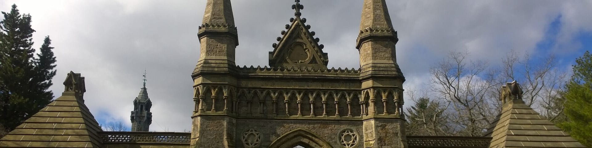 The impressive front main gate of Forest Hills Cemetery standing out against the #blue sky.
Built in 1848, Forest Hills Cemetery is a historic 275-acre cemetery, greenspace, arboretum and sculpture garden located in the Jamaica Plain neighborhood of Boston.