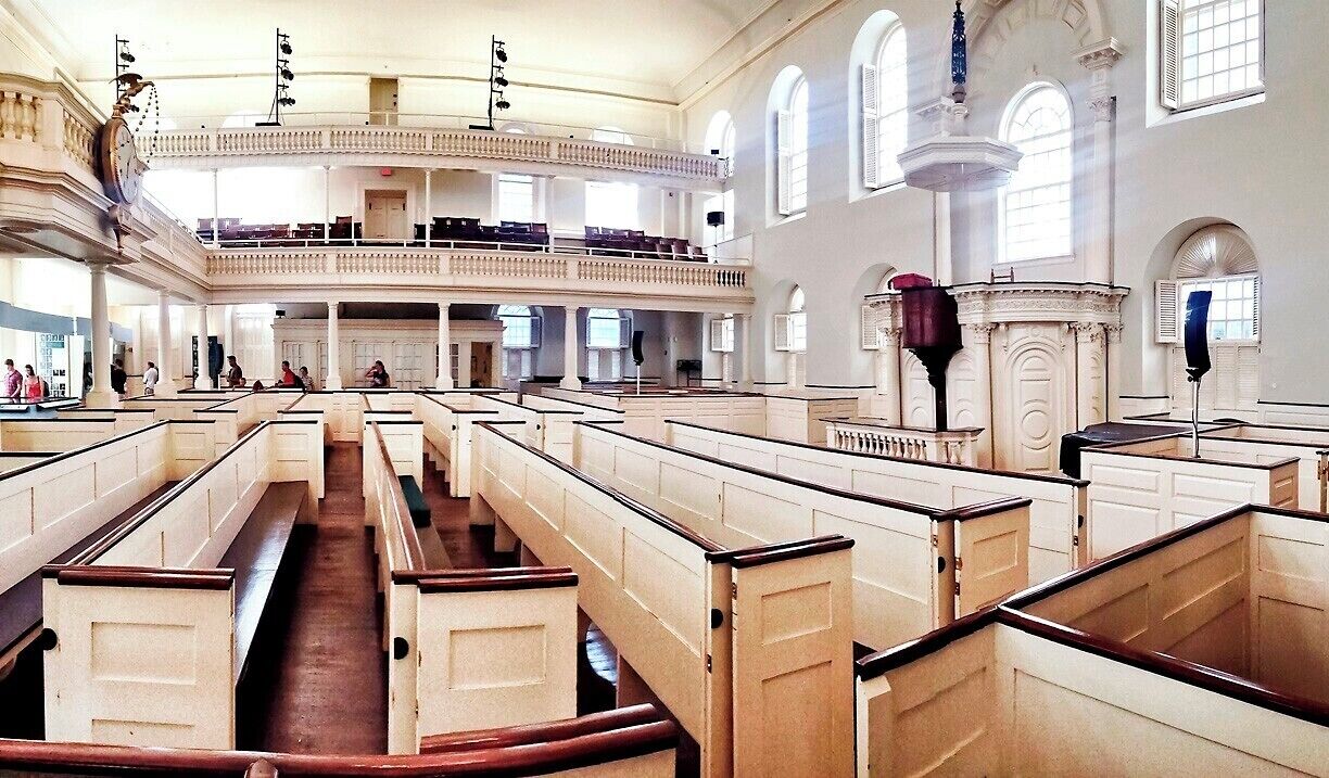 If America has a birthplace, this is it.  As the largest building in eighteenth-century Boston, Old South hosted some of the most important town meetings, where colonists debated and protested everything from forced impressment, to military occupation, to tea taxes.  Samuel Adams, John Hancock and Benjamin Franklin are just a few of the many figures that used Old South to press their cause.
Old South was built in 1729 to serve as a Puritan meeting house, and it's large open floor plan enabled nearly 6,000 colonists to gather under one roof. Once war broke out in 1775, the British holed up in Boston and converted Old South into an indoor riding school - removing and pews and pulpit and filling in interior with dirt. After the war it took the congregation eight years to restore the damage.
Although it survived the Great Boston Fire of 1872, the building was little used and was slated for demolition in 1876.  That it survives today is thanks to a group of twenty women who organized a $400,000 fund-raising campaign to save the building and open it as a museum.
Today you can still visit the Old South Meeting House, where thoughtful displays recount it's place in history. Also, be sure to gaze up at the steeple, where a 1766 tower clock (still operating) and an 1801 Paul Revere Bell keep the time.