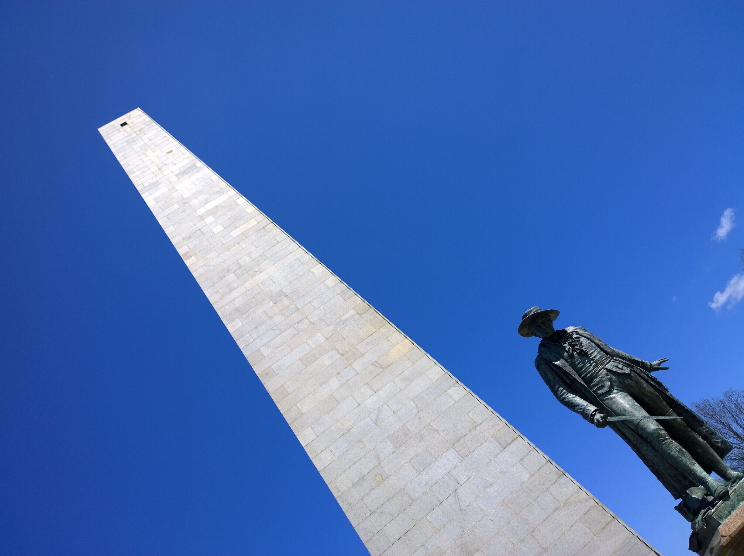 The Bunker Hill Monument was erected to commemorate the Battle of Bunker Hill (which actually took place on Breed's Hill), the first major conflict between British and Patriot forces in the American Revolutionary War, fought there June 17, 1775. 

The 221-foot granite obelisk (compared to 554 feet of the Washington Monument) was erected between 1827 and 1843 in Charlestown, Massachusetts.