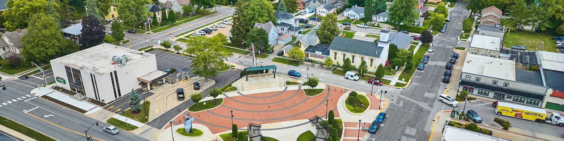 James Cultural Plaza aerial in Auburn with houses and church