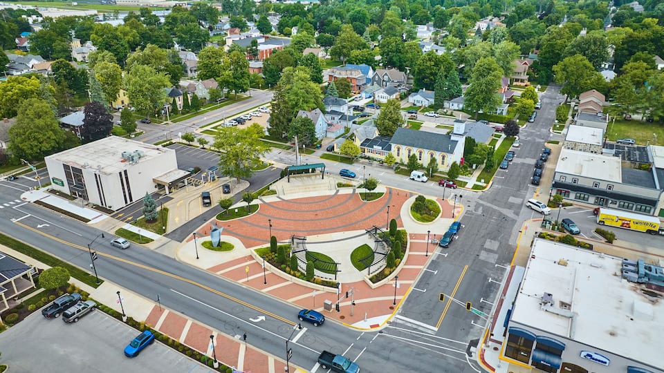 James Cultural Plaza aerial in Auburn with houses and church