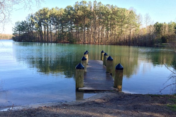 1.5 miles around. No swimming. But a playground for the kiddos, dog friendly and tons of fishing spots :)