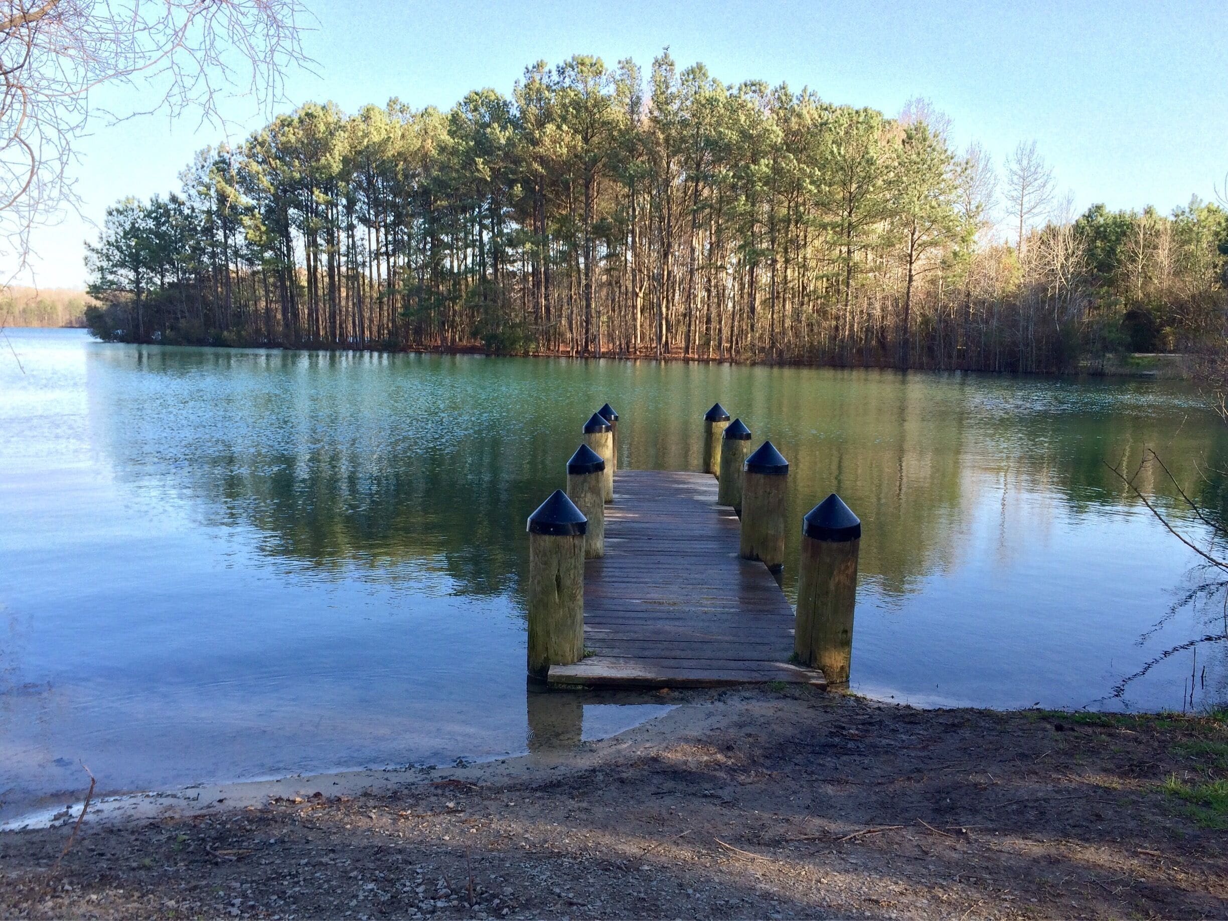 1.5 miles around. No swimming. But a playground for the kiddos, dog friendly and tons of fishing spots :) 