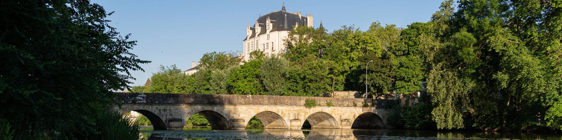 Castle Raoul and bridge with Reflection in Water, Chateauroux city, France