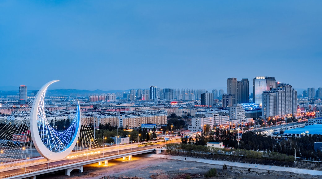 Night view of the urban skyline of the Galaxy Bridge in Chifeng, Inner Mongolia, China