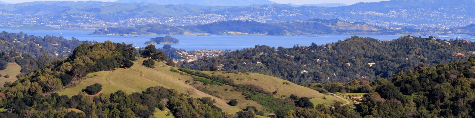 Green rolling hills of Marin County with view of San Francisco Bay