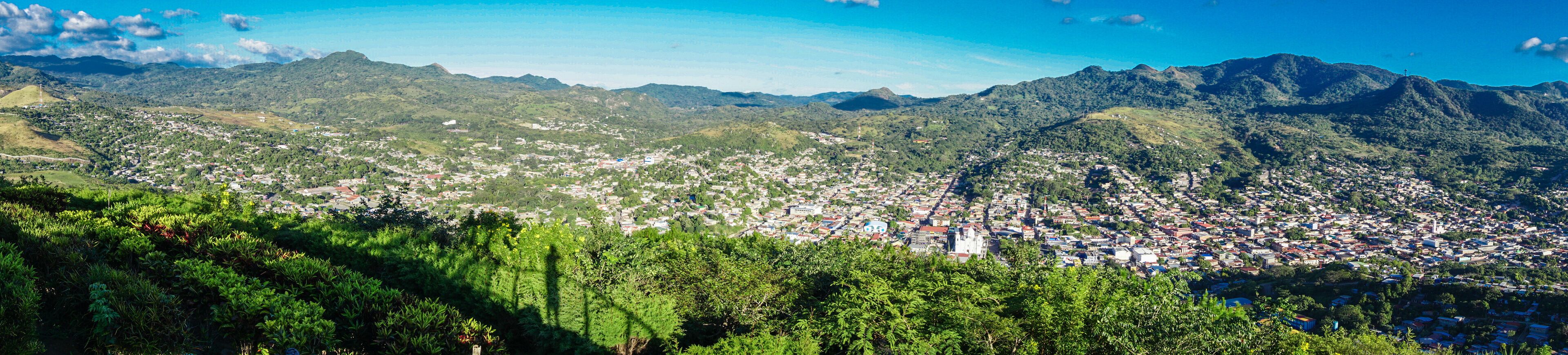 A mountainous landscape with a town nestled in the valley.