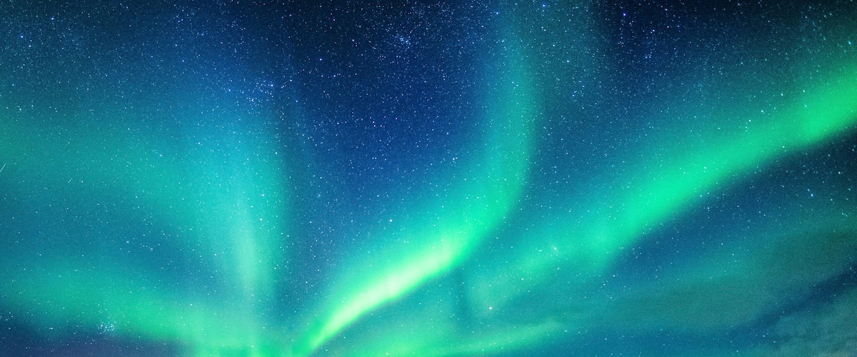 A night sky with visible aurora borealis.