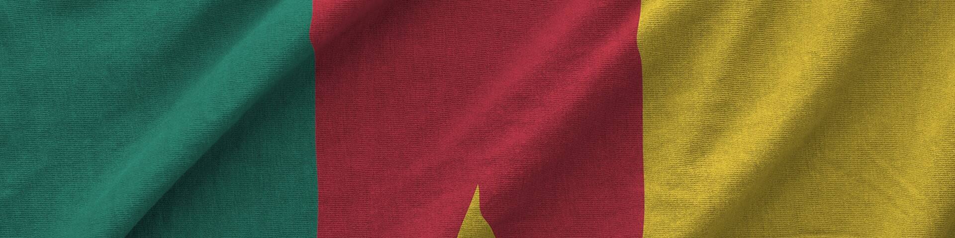 Cameroon flag depicted on folded wavy fabric of old cloth close up