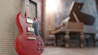 Red electric guitar in a beautiful old room