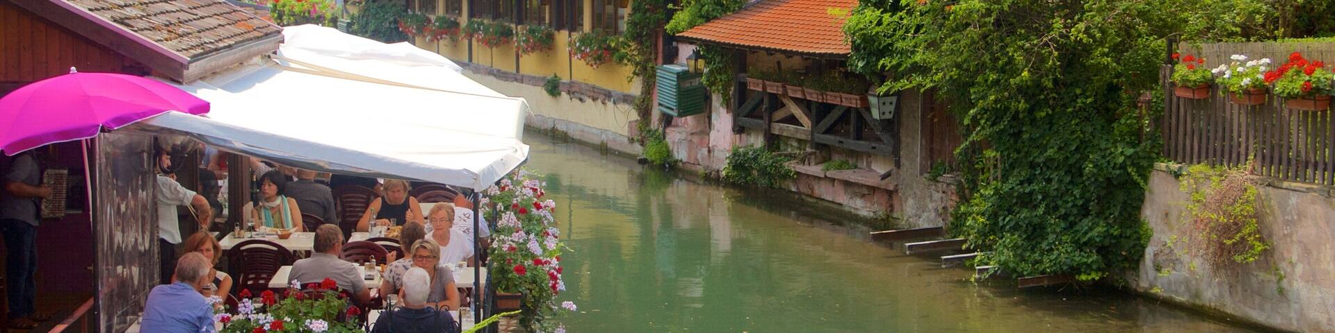 Colmar showing a river or creek, heritage elements and outdoor eating