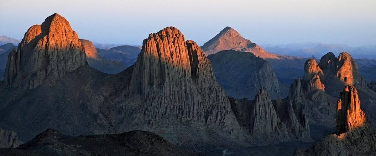 A rugged mountain range with prominent peaks and valleys.