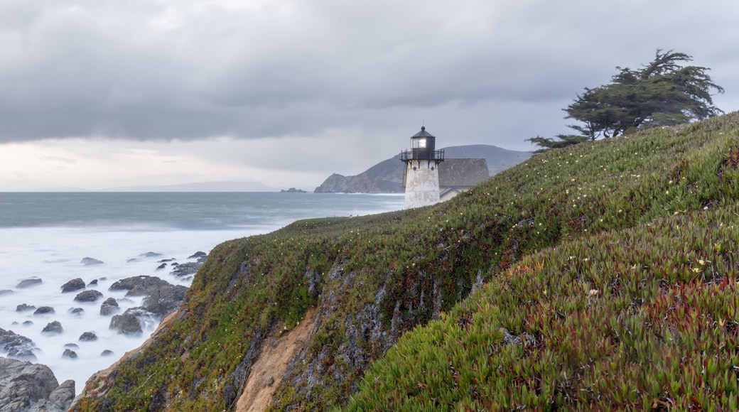 Point Montara Lighthouse and the Pacific Ocean Coastline on a winter evening. Montara, San Mateo County, California, USA.