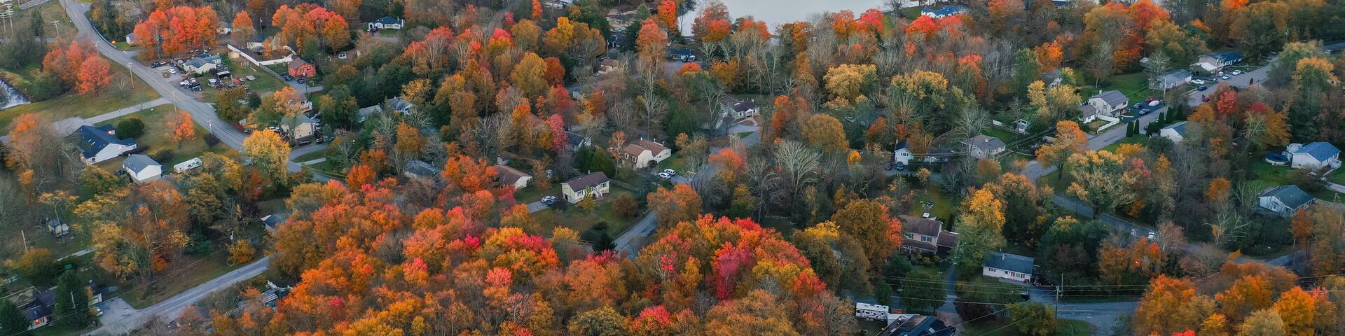 Lake Neepaulin Sussex NJ dusk in Autumn aerial Wawayanda Mountains Vernon in background