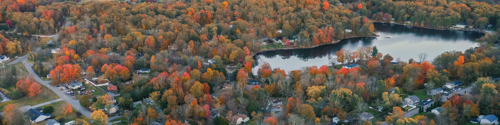 Lake Neepaulin Sussex NJ dusk in Autumn aerial Wawayanda Mountains Vernon in background
