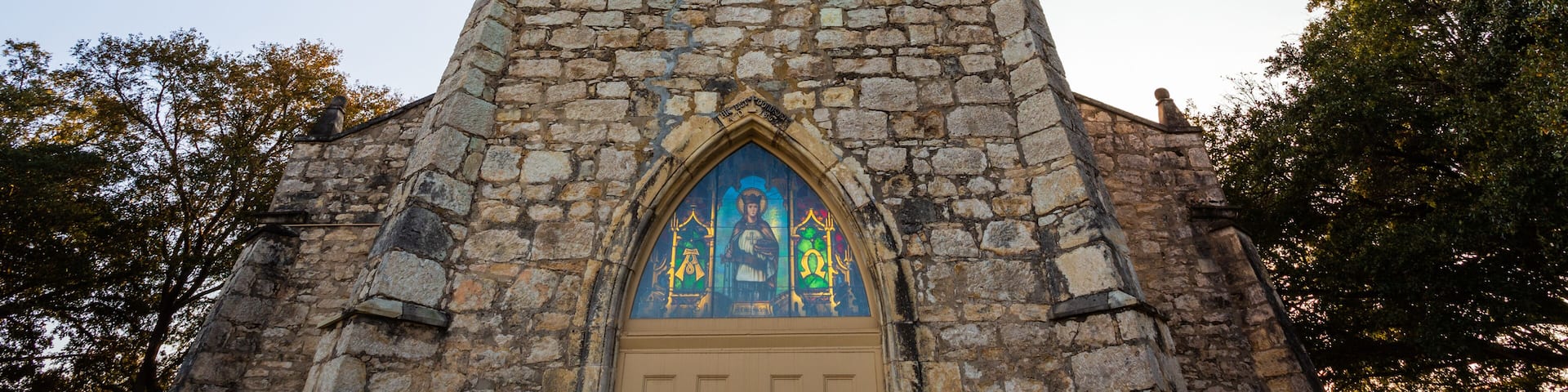 Sun shining through stained glass at St. Louis Catholic Church in Castroville was built in 1867 with local limestone. The Parish was established in 1844 with the earliest settlement of the town.