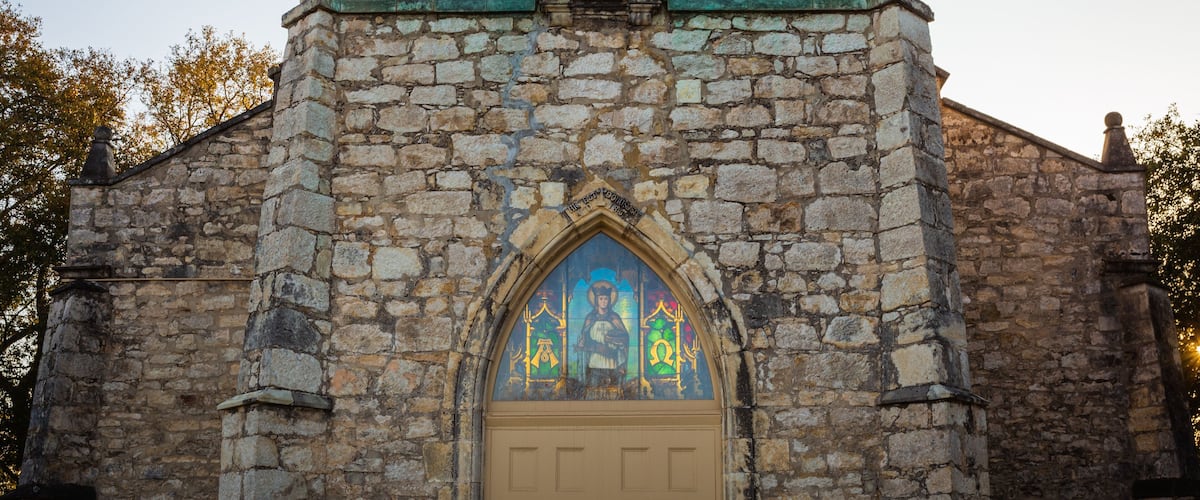 Sun shining through stained glass at St. Louis Catholic Church in Castroville was built in 1867 with local limestone. The Parish was established in 1844 with the earliest settlement of the town.