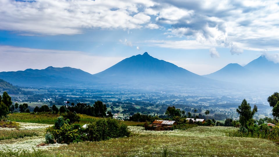 A mountain range with a village in the valley.