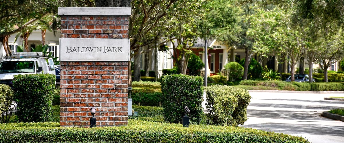 Entrance sign at Baldwin Park in Orlando, Florida. A tranquil, primarily residential community with tree-lined streets.