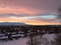 This is a northwest view of the Oquirrh Mts on the west side of Salt Lake Valley. They are covered by low hanging clouds as well as higher ones. Off to the right is Antelope Island in the Great Salt Lake.