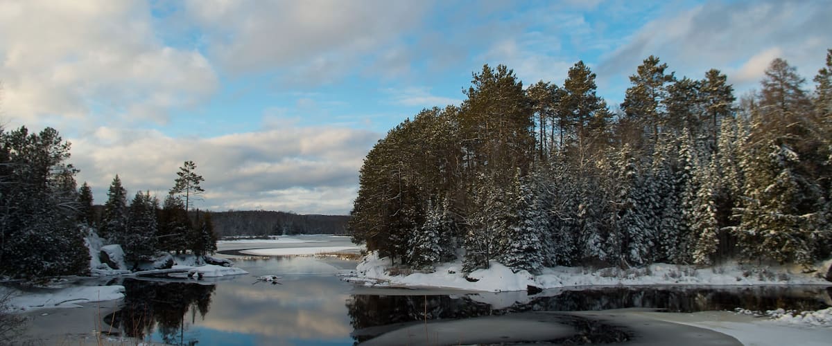 Lake in Winter on a Blue Sky White Cloud Day