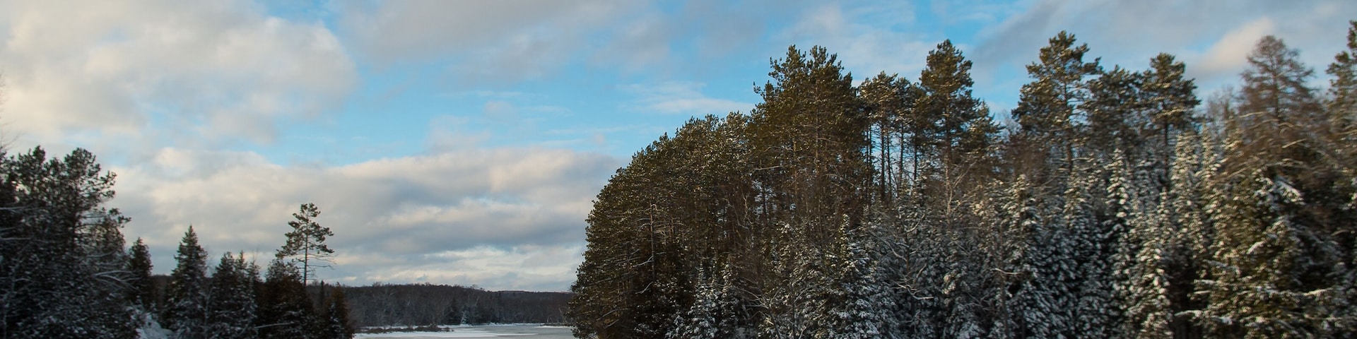 Lake in Winter on a Blue Sky White Cloud Day