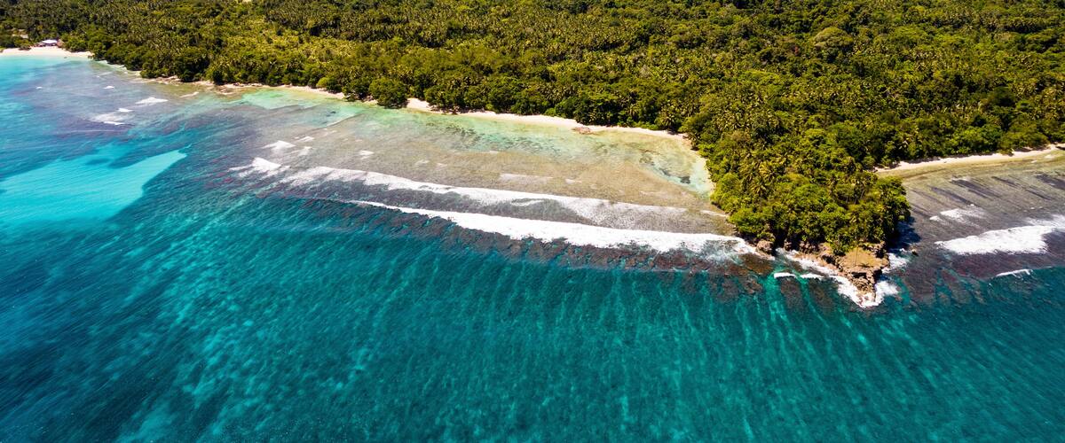 Aerial Drone View of Coast of Musho Island, Wewak East Sepik Province, Papua New Guinea.