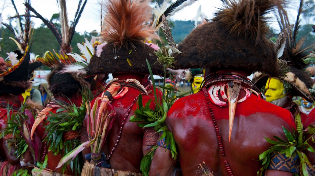Colorful dressed and face painted local tribes celebrating the traditional Sing Sing in Enga in the Highlands of Papua New Guinea