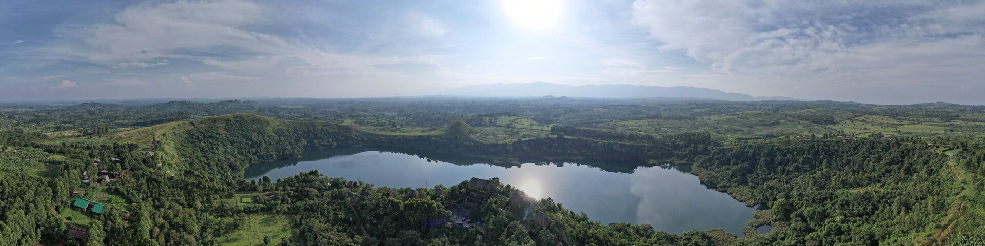 Aerial View of Lake Kyaninga at sunset and the forest, Kabarole, Uganda.