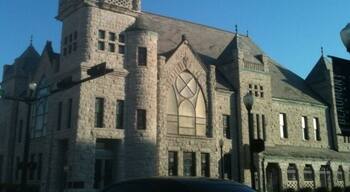 The most eye-catching building in downtown Beaumont is the Tyrrell Library. Constructed in 1903 as the First Baptist Church of Beaumont, it replaced a red brick church that had previously occupied the site.
The rough-quarried limestone exterior instantly reminds the first-time viewer of a medieval castle