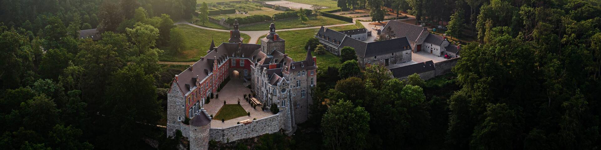 MIelmont castle in Belgium Mazy town. More than 800 years old medival castle panoramic view with amazing mornig lights. This is a luxury hotel.