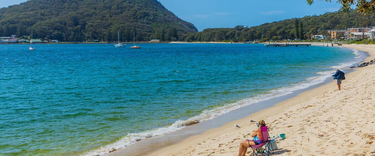 Shoal Bay Beach showing a sandy beach and general coastal views