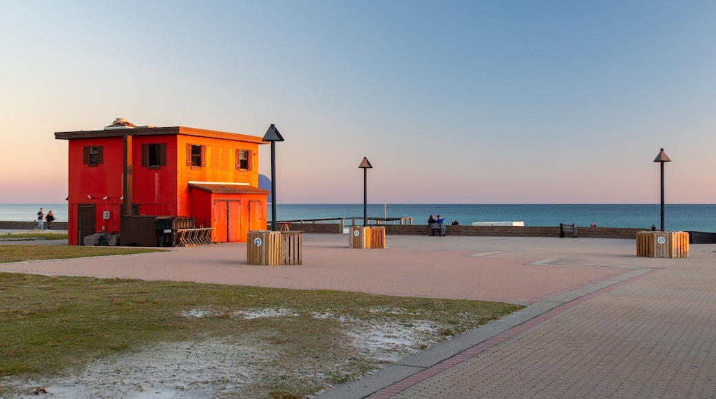 Pensacola Beach which includes a sunset and general coastal views