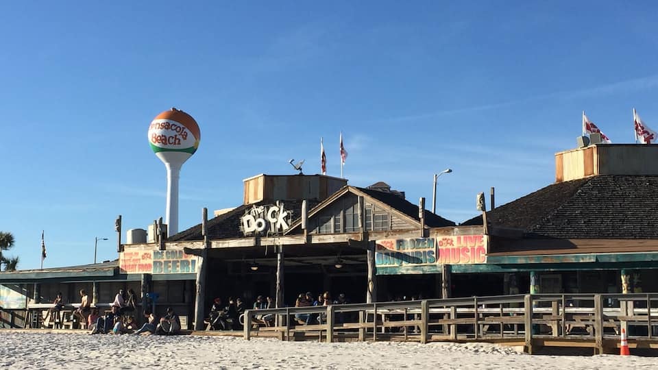 The Dock is a very casual laid back bar just steps away from the beach in Pensacola beach. Great ambiance and location.