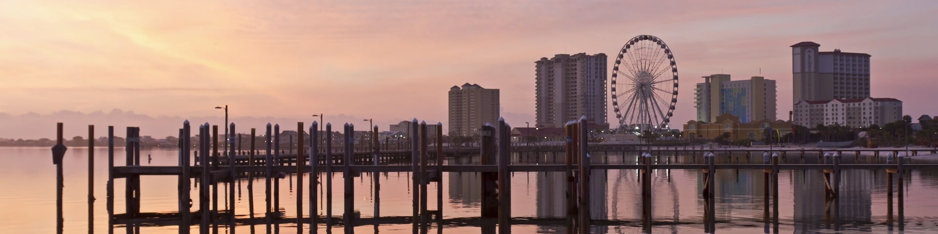 Sunrise on the Pensacola Beach ferris wheel on Santa Rosa Sound in Pensacola Beach, Florida; Shutterstock ID 137288363