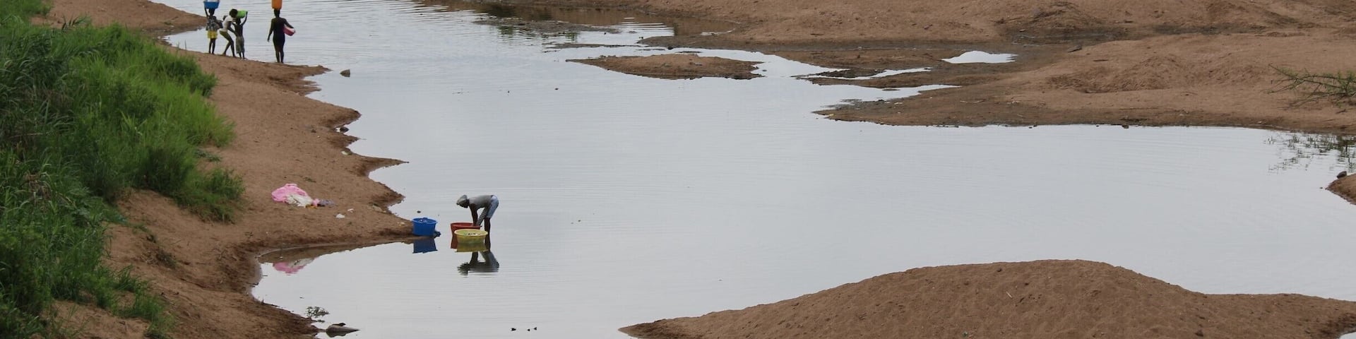 Near Kwanza river in Angola. People washing cloths
