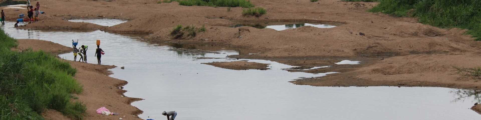 Near Kwanza river in Angola. People washing cloths