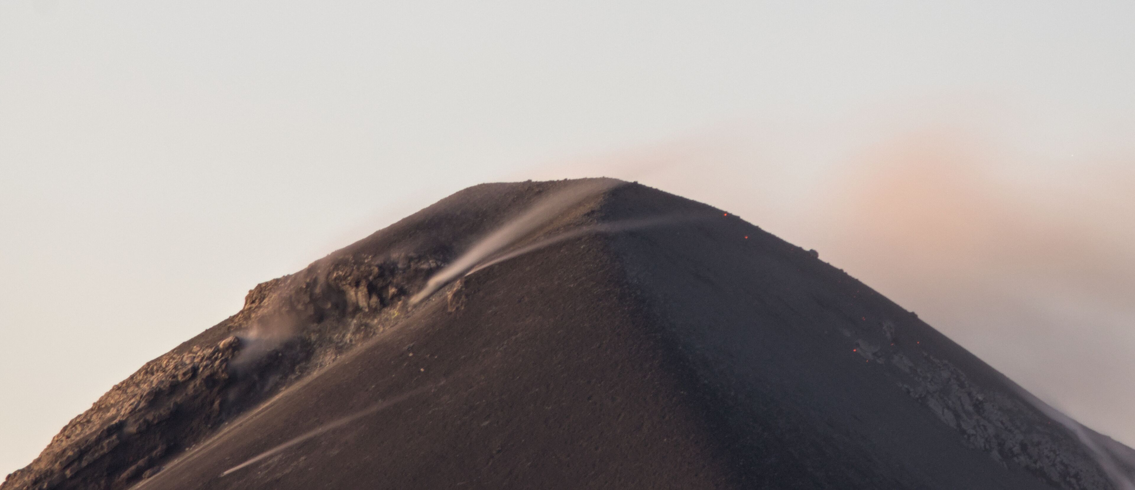 view of active volcano fuego from the top of hiking trail acatenango in antigua guatemala (scenic tree forest view of smoke lava erupting seismic activity) trail hike adventure outdoor travel tourism