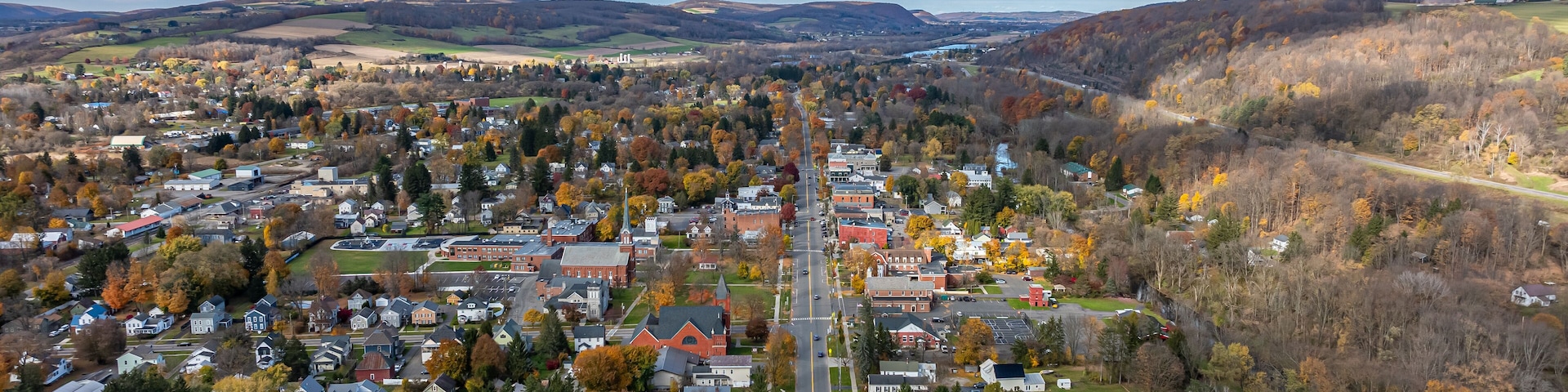 Aerial photo of fall foliage surrounding the Village of Homer, Cortland County, New York State, October 2024.