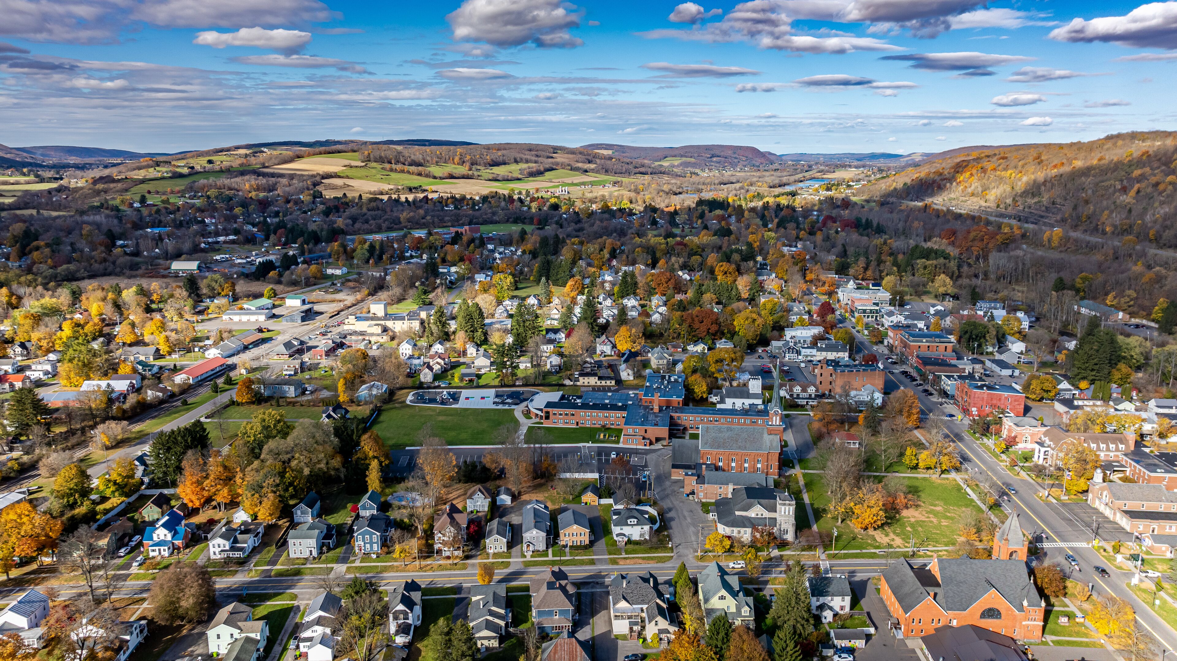 Aerial photo of fall foliage surrounding the Village of Homer, Cortland County, New York State, October 2024.	