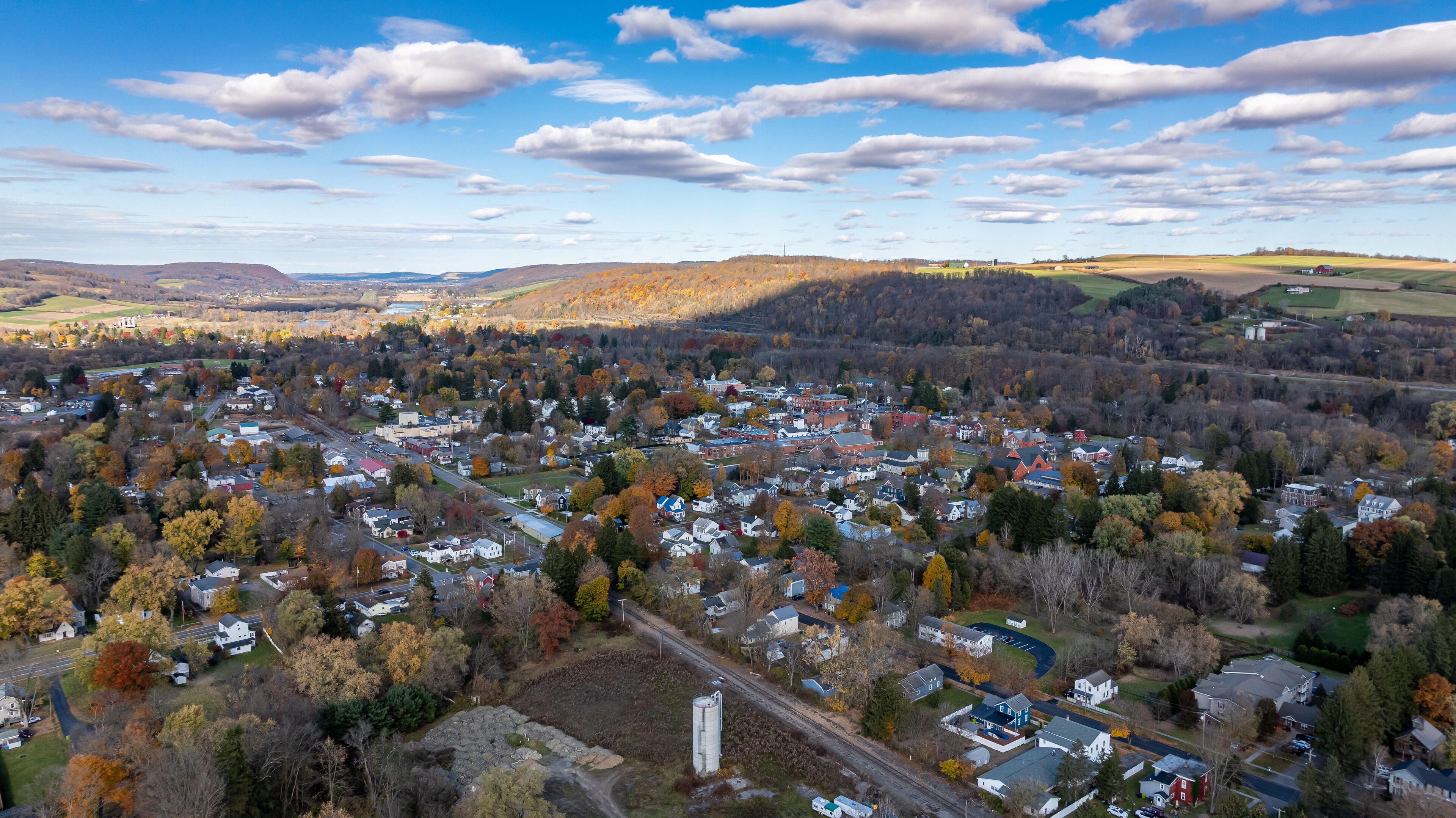 Aerial photo of fall foliage surrounding the Village of Homer, Cortland County, New York State, October 2024.	