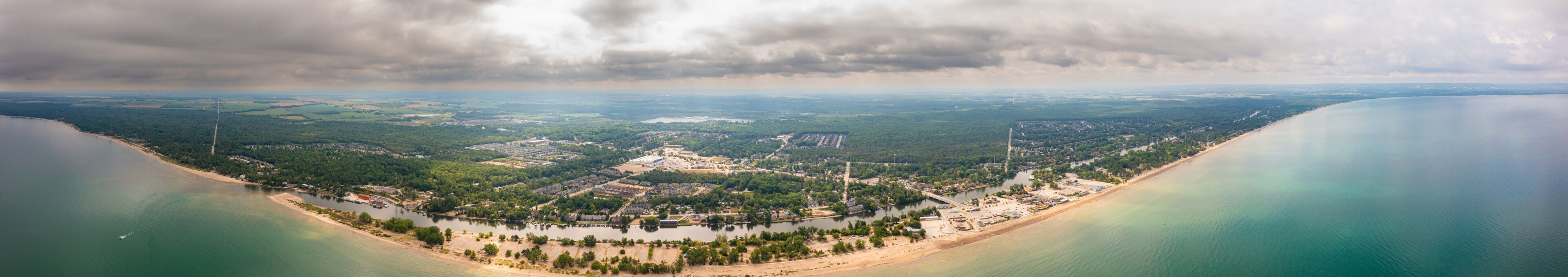 Wasaga beach panorama  shoreline  blue water cloudy skies