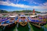 Fishing trawlers moored at Hamel Lighthouse harbor under the cable cars in Yeosu City, South Korea