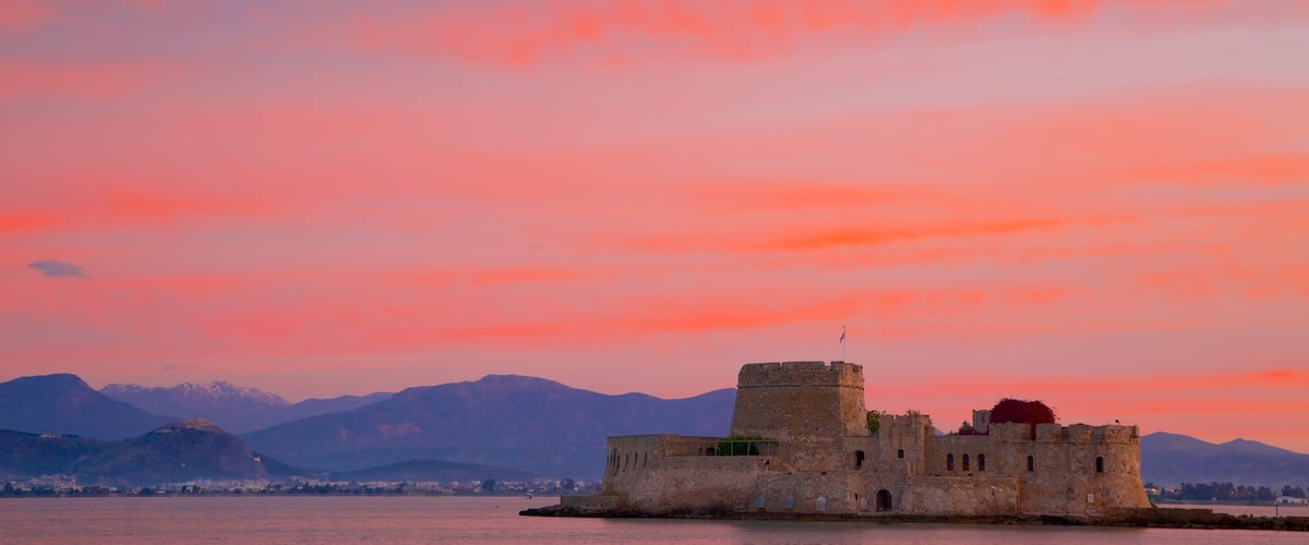 Greece showing a sunset and heritage architecture